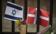 A Danish and an Israeli flag are seen among flowers and candles honouring the shooting victims outside the main Synagogue in Copenhagen, Denmark on February 15, 2015.  Two fatal attacks in the Danish capital, at a cultural center during a debate on Islam and free speech and a second outside the city's main synagogue. France's ambassador to Denmark Francois Zimeray, who was attending the debate, told AFP the attackers were seeking to replicate the January 7 assault by jihadists in Paris on satirical newspaper Charlie Hebdo that left 12 dead. AFP PHOTO / ODD ANDERSEN        (Photo credit should read ODD ANDERSEN/AFP/Getty Images)